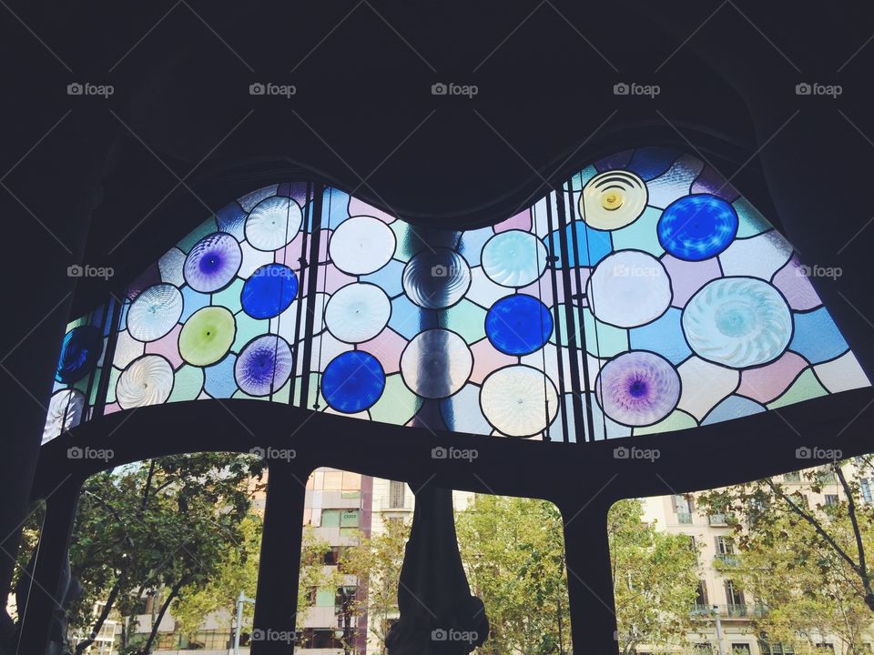 Stained glass window in Casa Batllo in Barcelona Spain designed by Gaudi