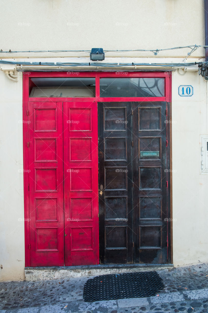 Old door in the city of Cefalu on Sicily.