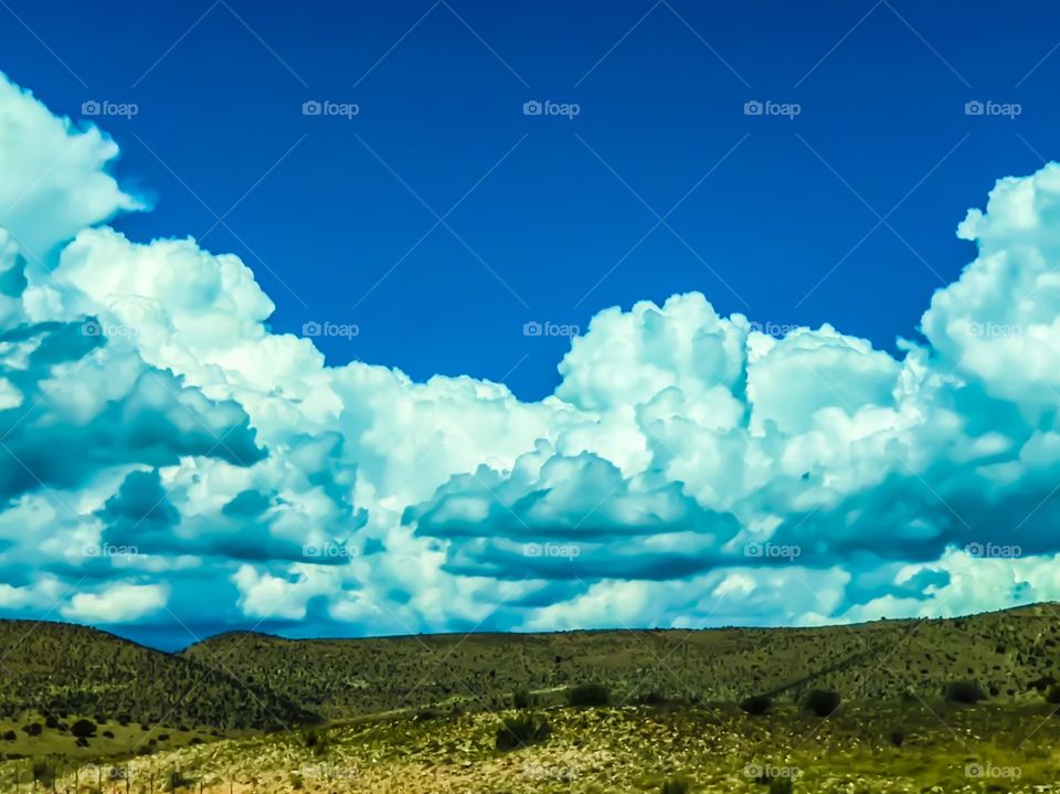 Clouds over Green Field