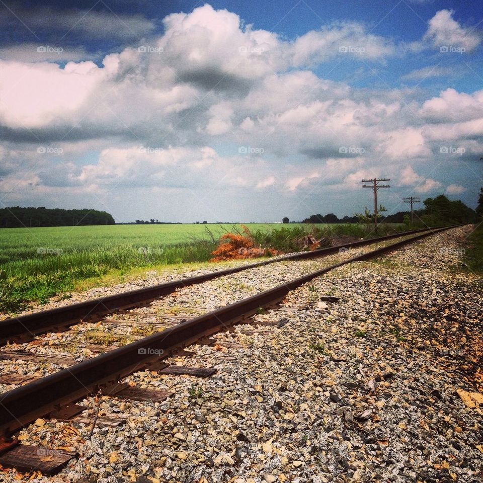 Train tracks through farm country