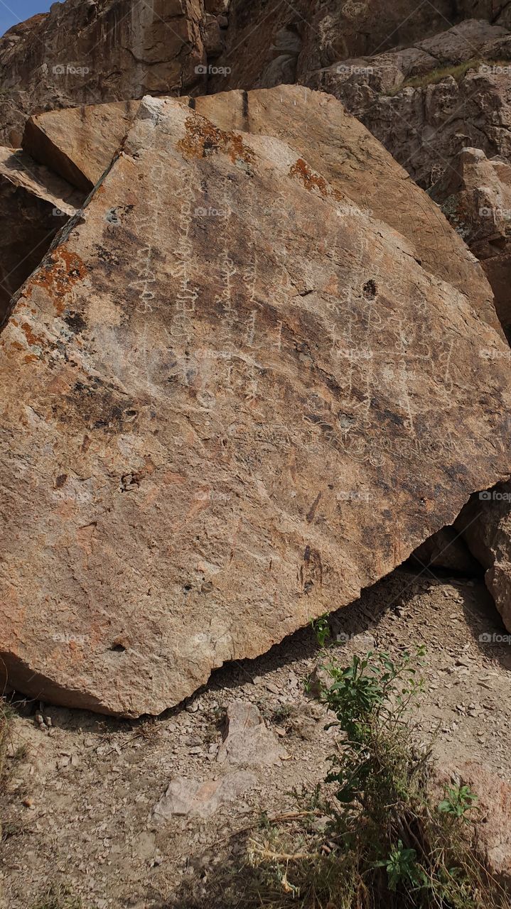 ancient script on the rocks in Tamgaly tas
