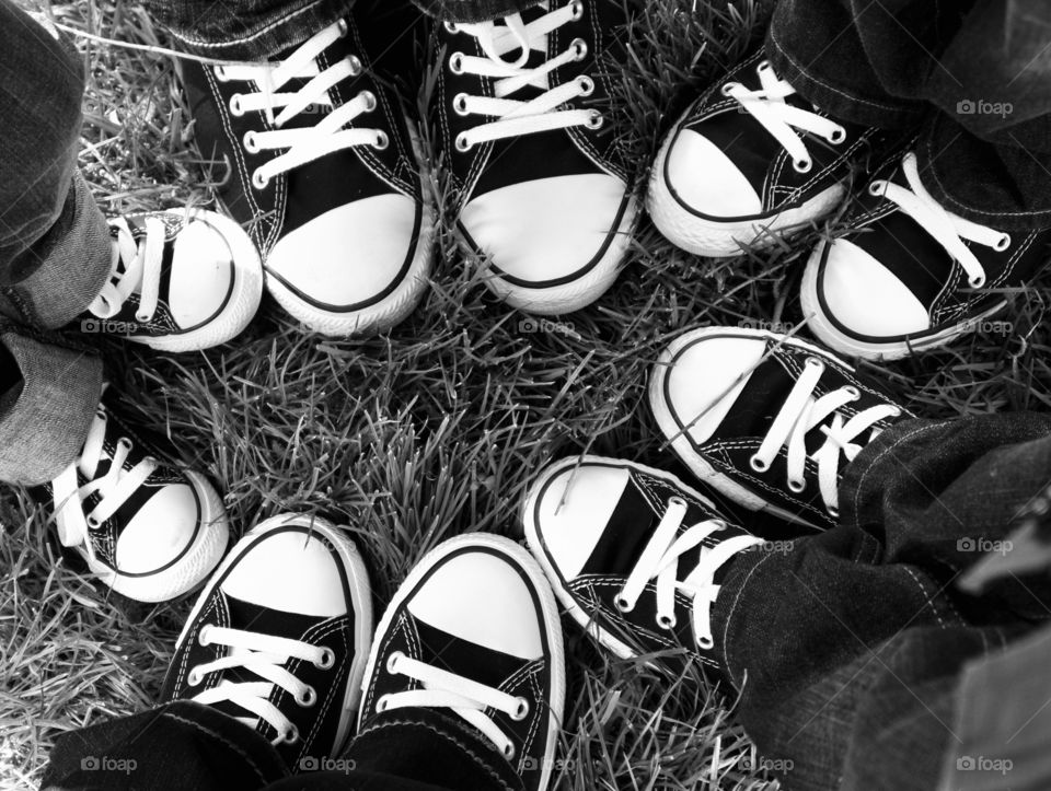 A circle of black and white shoes