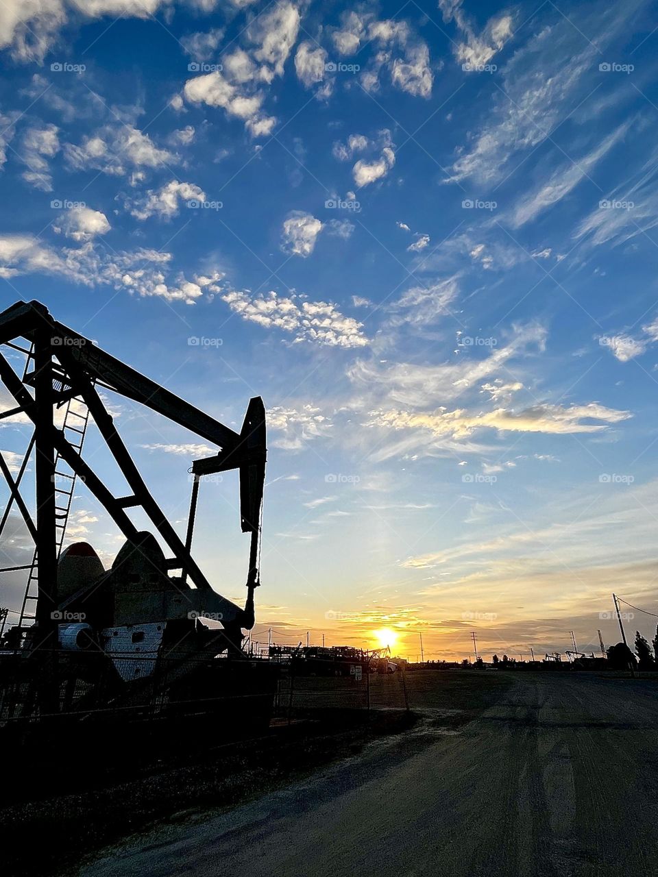 Oil Pump Silhouette at Sunset