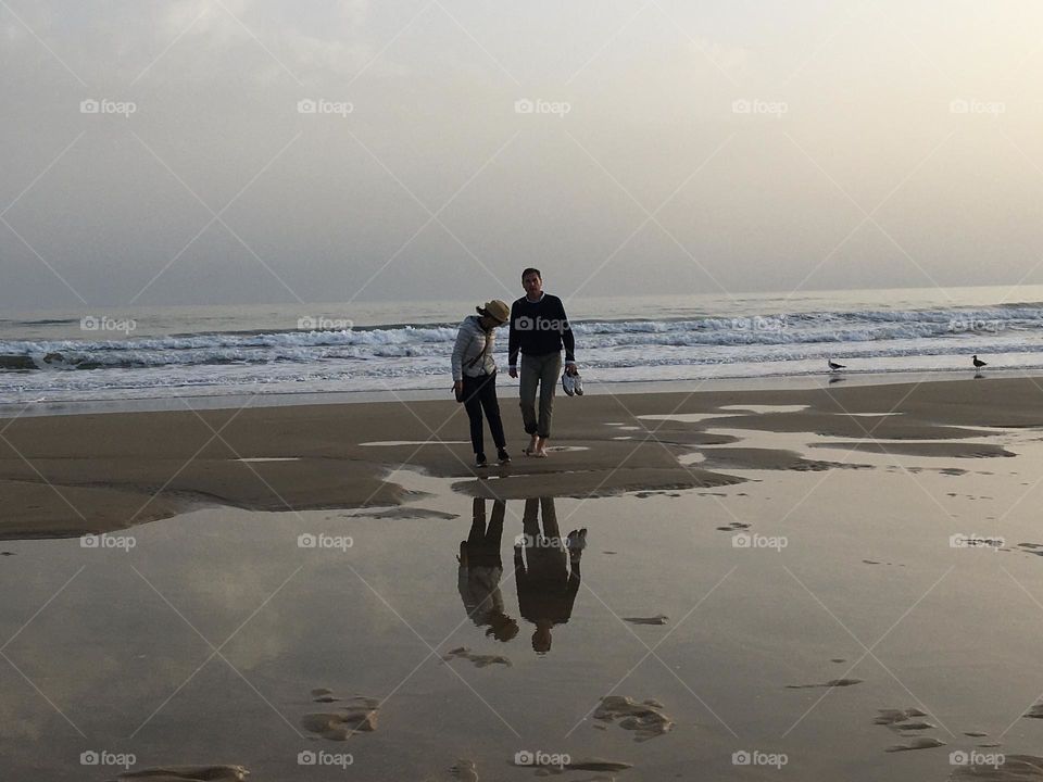 A couple on beach at evening