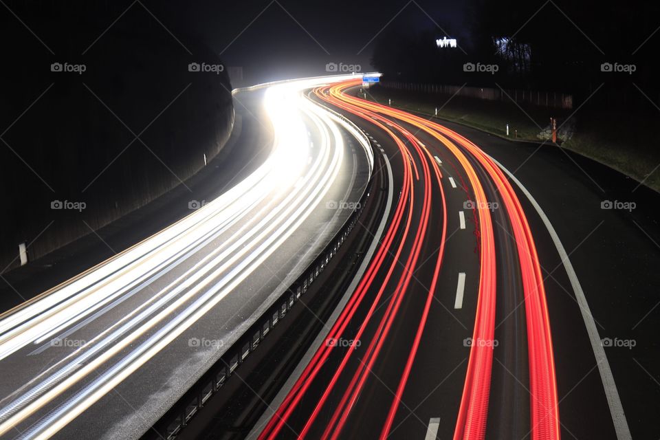Light trail of traffic on highway.