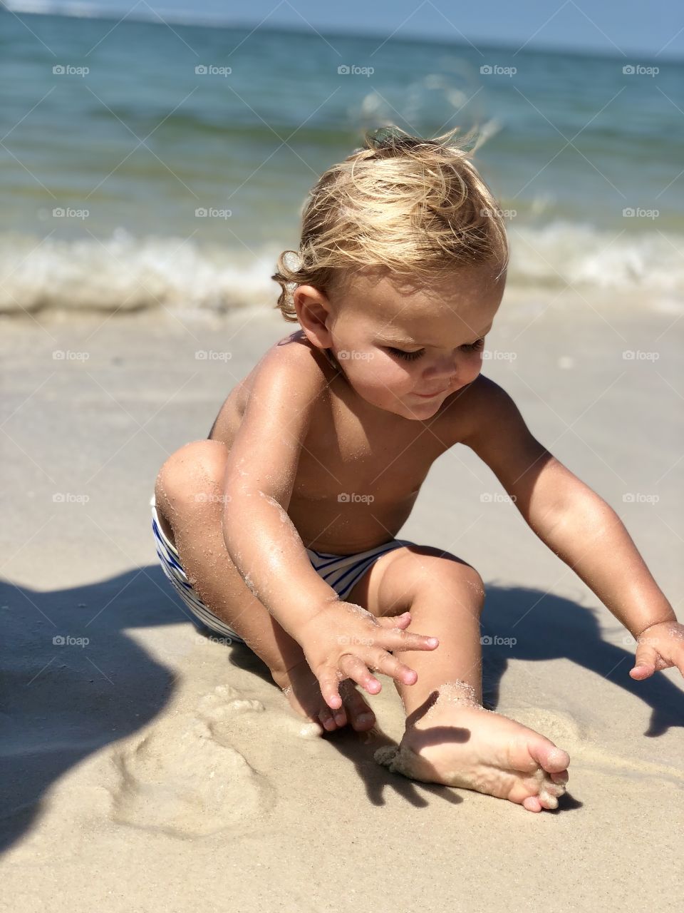 Blonde sandy beach baby. 