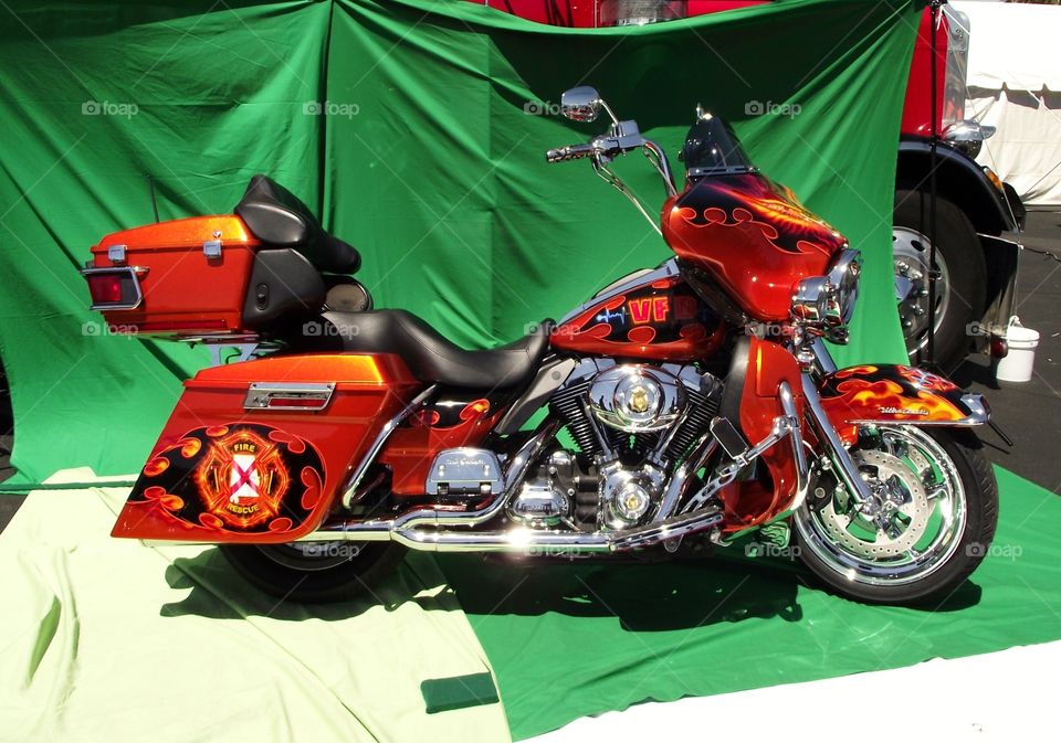 motorcycle with custom paint job red fireman theme