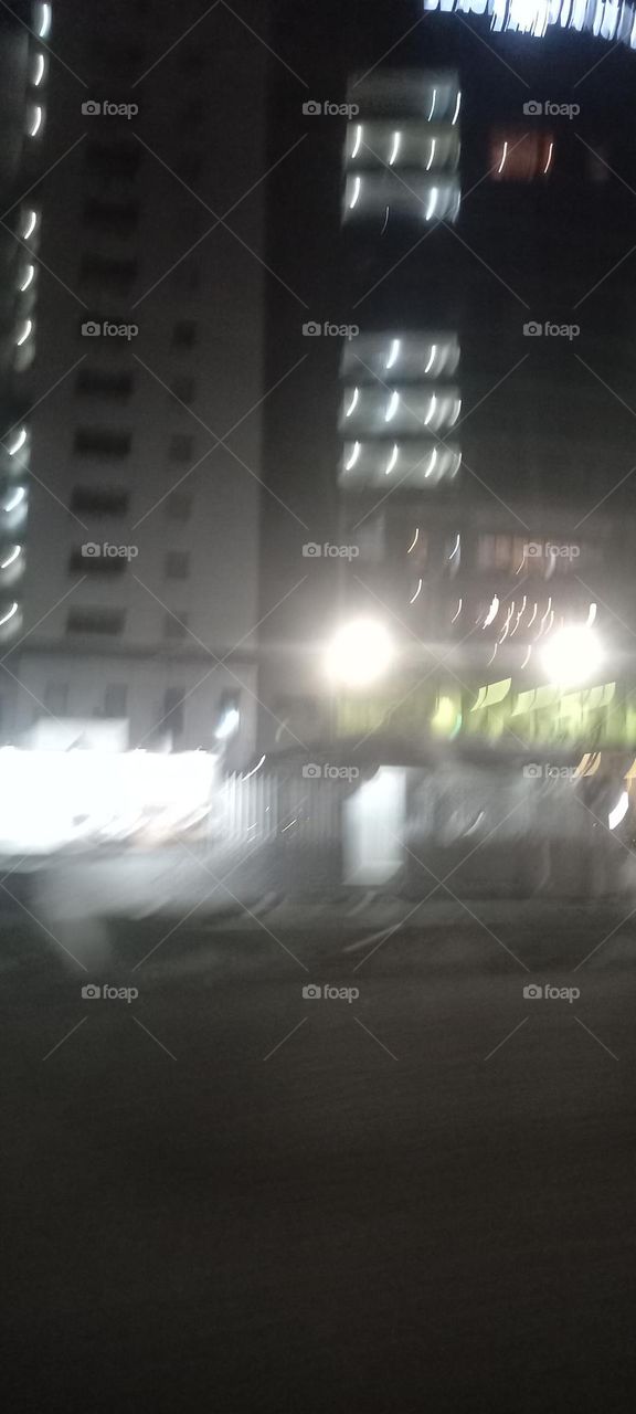 Twinkling windows , the beauty of evening light. Bask in the beauty of evening light with the view of light twinkling from these windows at night