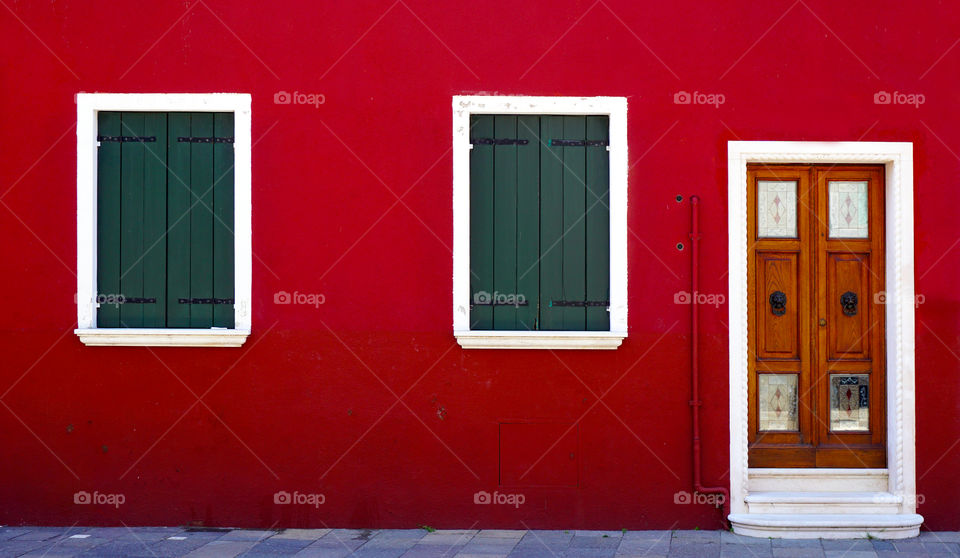 Colourful building red wall with door and windows