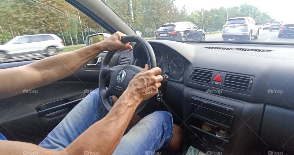 driver in car road window view summer time