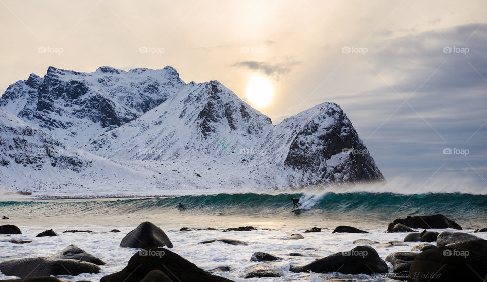 Distant view of person surfing in winter