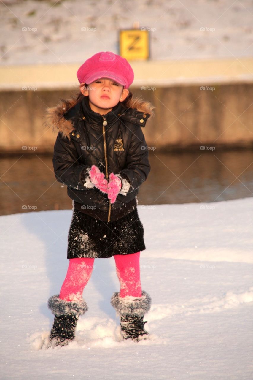 A little attitude girl posing in the snow