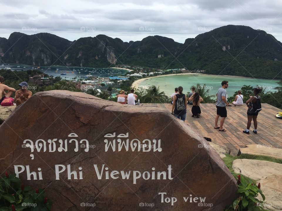 Travellers enjoying the view over Koh Phi Phi after a steep climb in the afternoon sun
