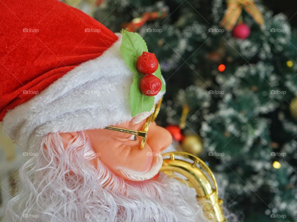 Santa Claus is depicted as an old man with a long white beard, a stocky body, and red clothes.