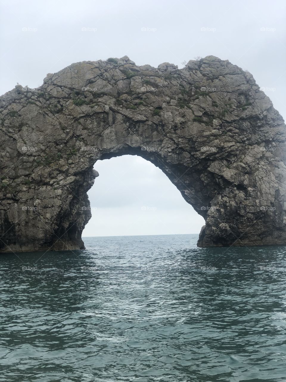 This is took while in durdle door in the uk. very beautiful arch with nice calm cold sea
