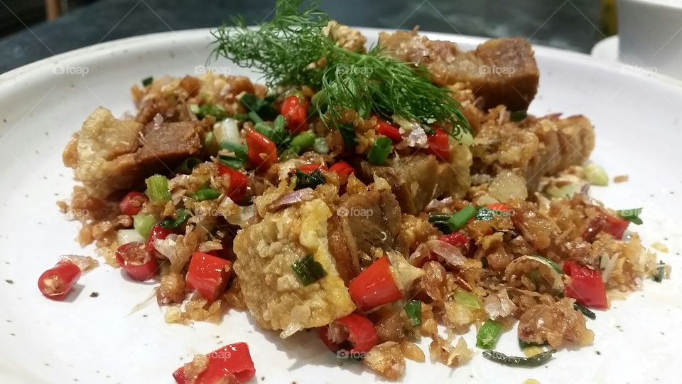 Crispy pork roast with salt and garlic chili is the one of popular traditional thai food