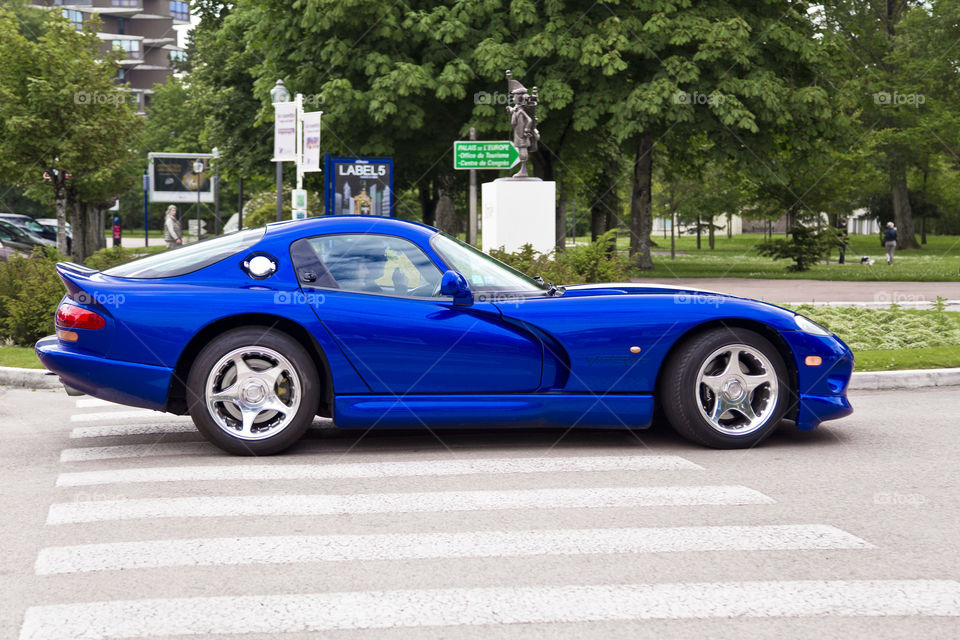 Dodge Viper GTS. Blue exotic sport car on the streets