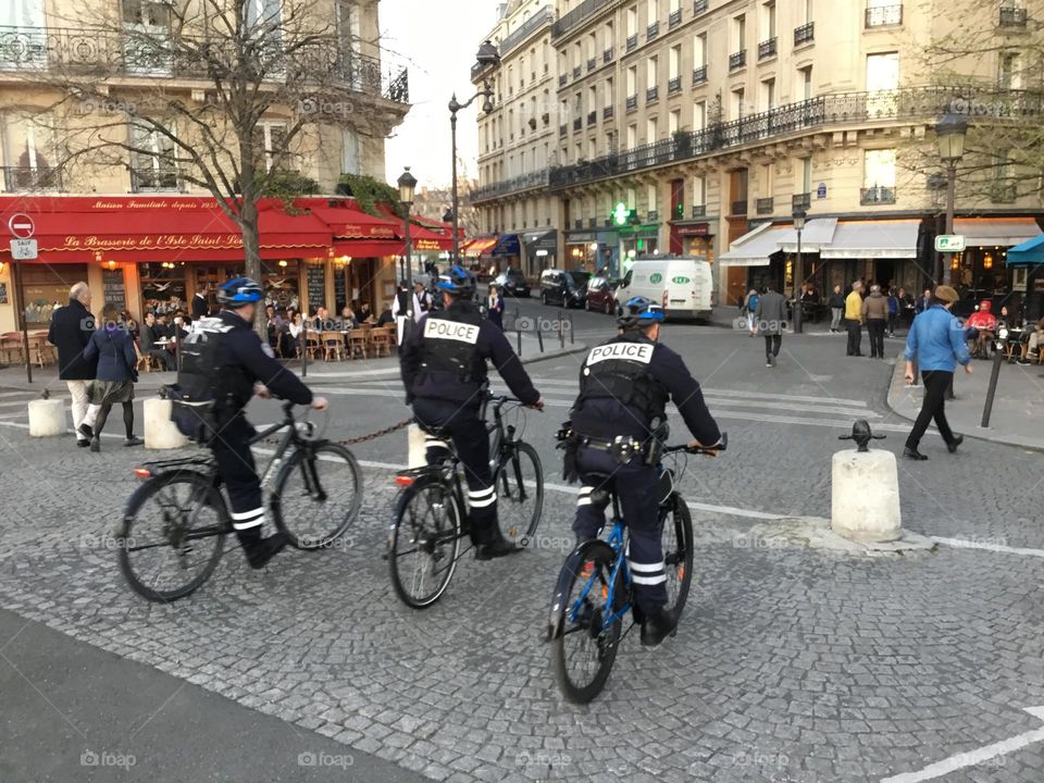 Police in Paris on street bikes to get around easily- Scooters and Bicycles on city streets. The law allows people to operate bicycles with electric assist (e-bikes) on some streets and highways