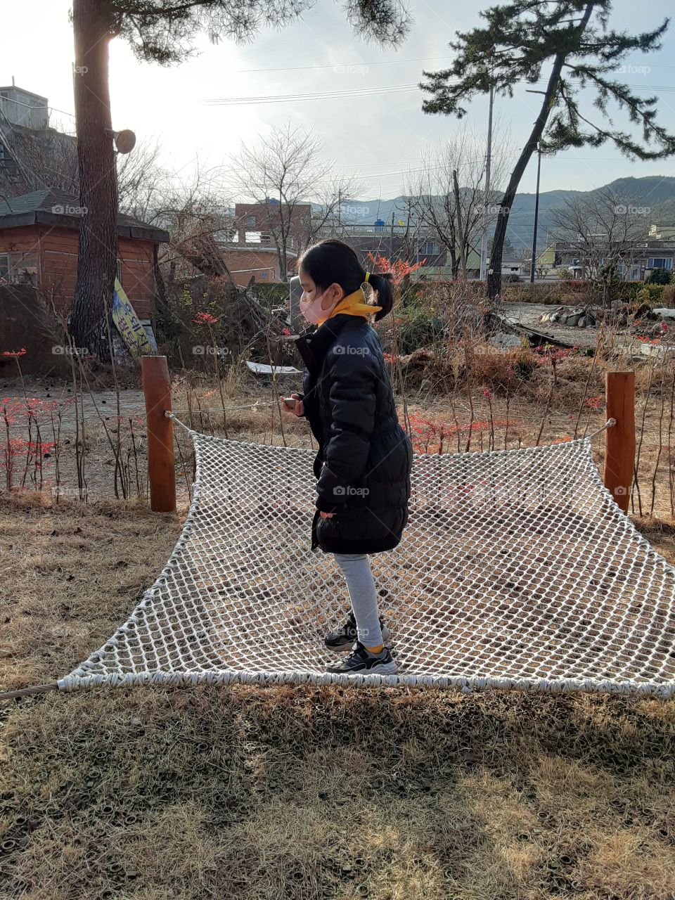 she's enjoying jumping on it even she's little scared without me holding her. she tried to balance her self .