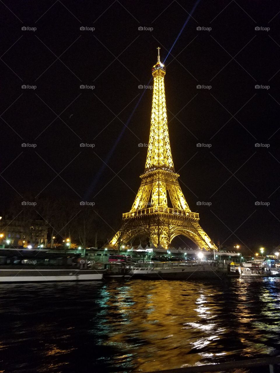 Reflections from the Eiffel Tower on the Seine.