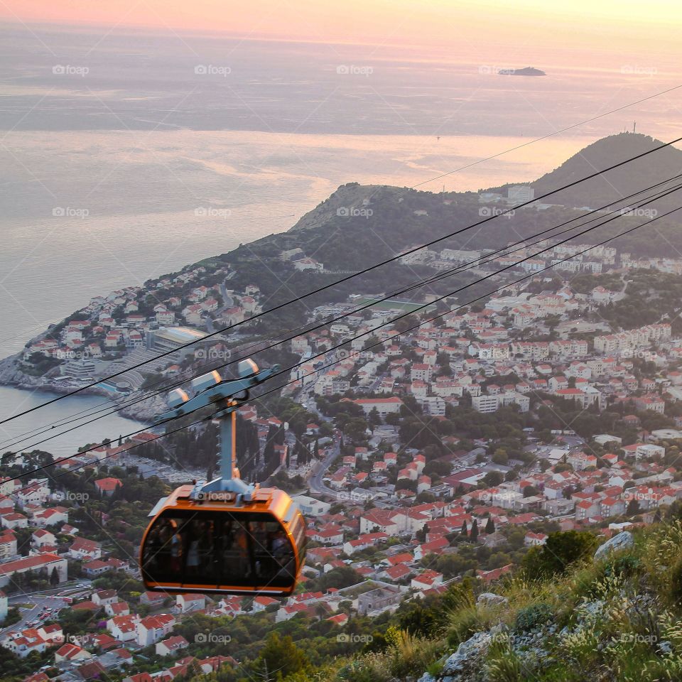 View of overhead cable car over mountain