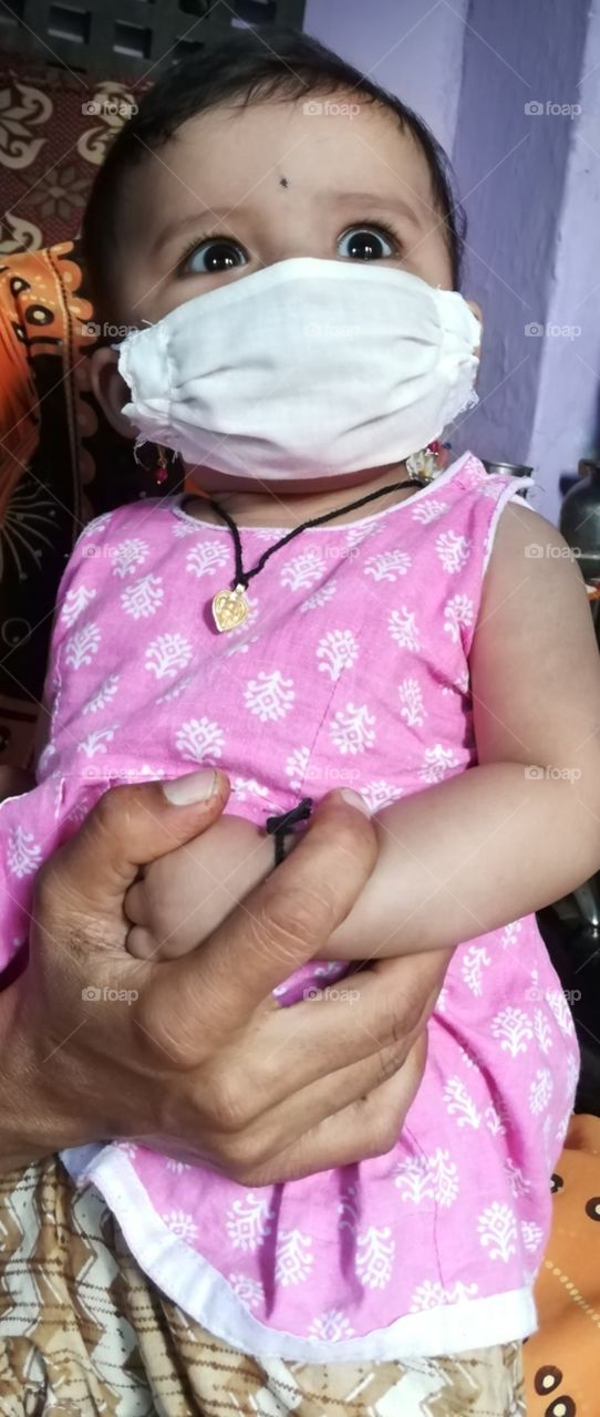 Corona pandemic : baby with mask, covid