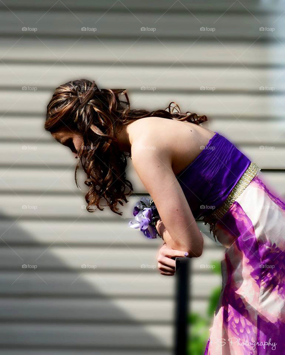 Senior prom. Teenage girl getting ready for senior prom, takes in the moment