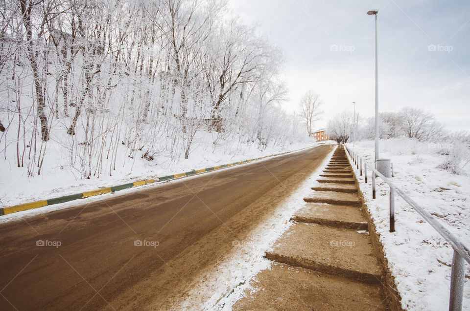 Winter road on city outskirts