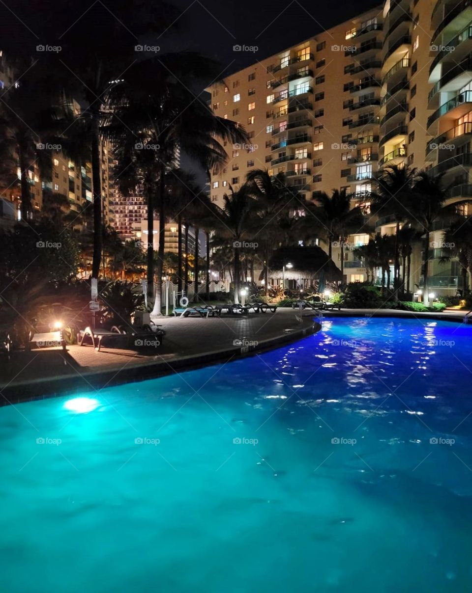 Hotel pool in the yard in the evening