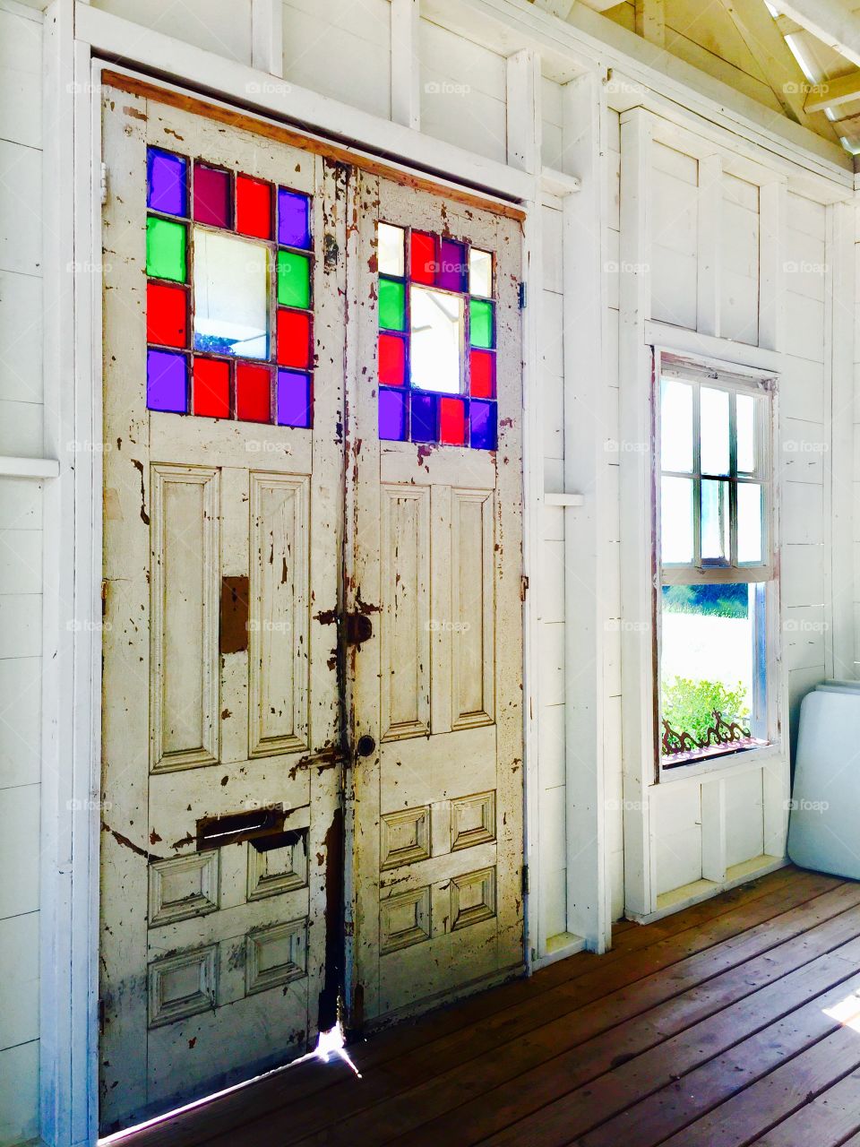 Colorful stained glass on wooden door
