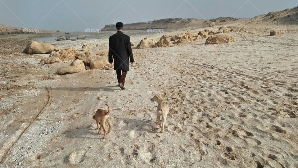 People walking with dog.