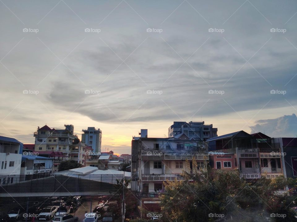 Clouds at sunset over buildings in Phnom Penh Cambodia