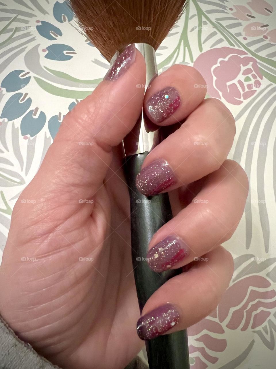 Glittery gel nail polish manicure 