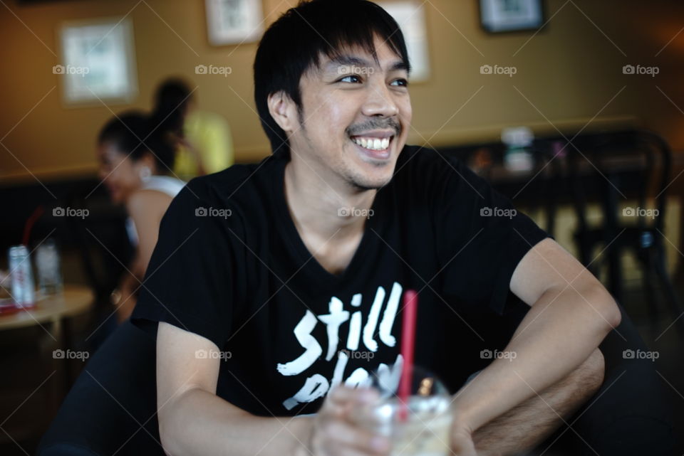 Asian man in cafe