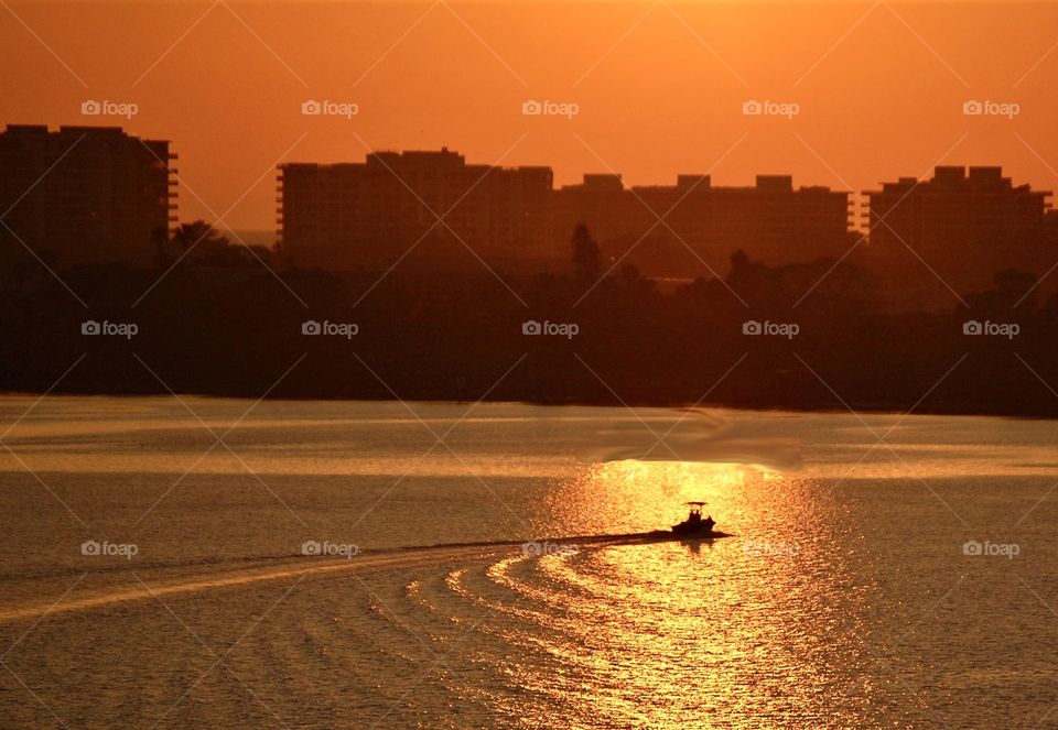 The golden hour, boat on the ocean during sunset