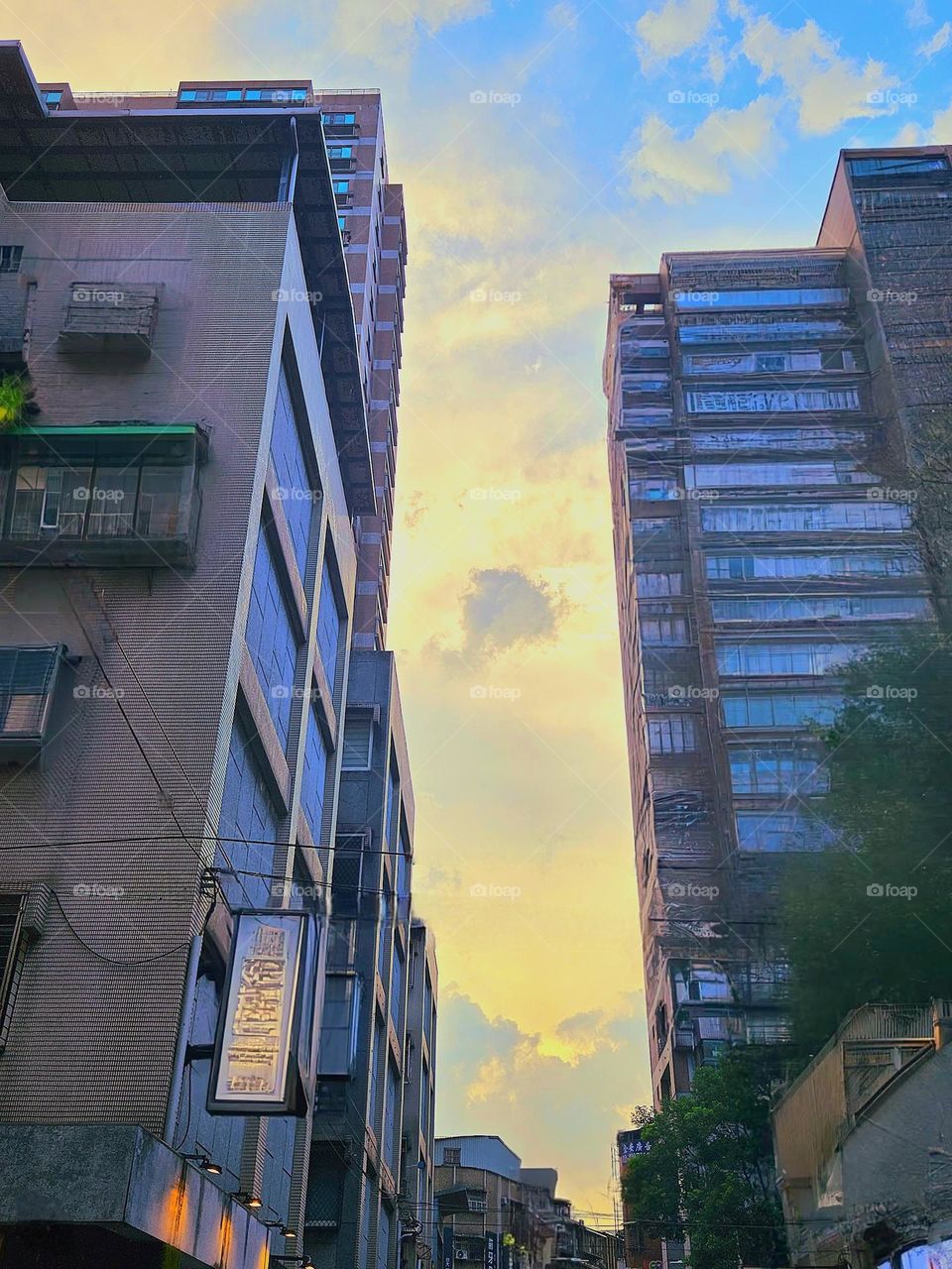 Sky and street scene between city buildings in the evening