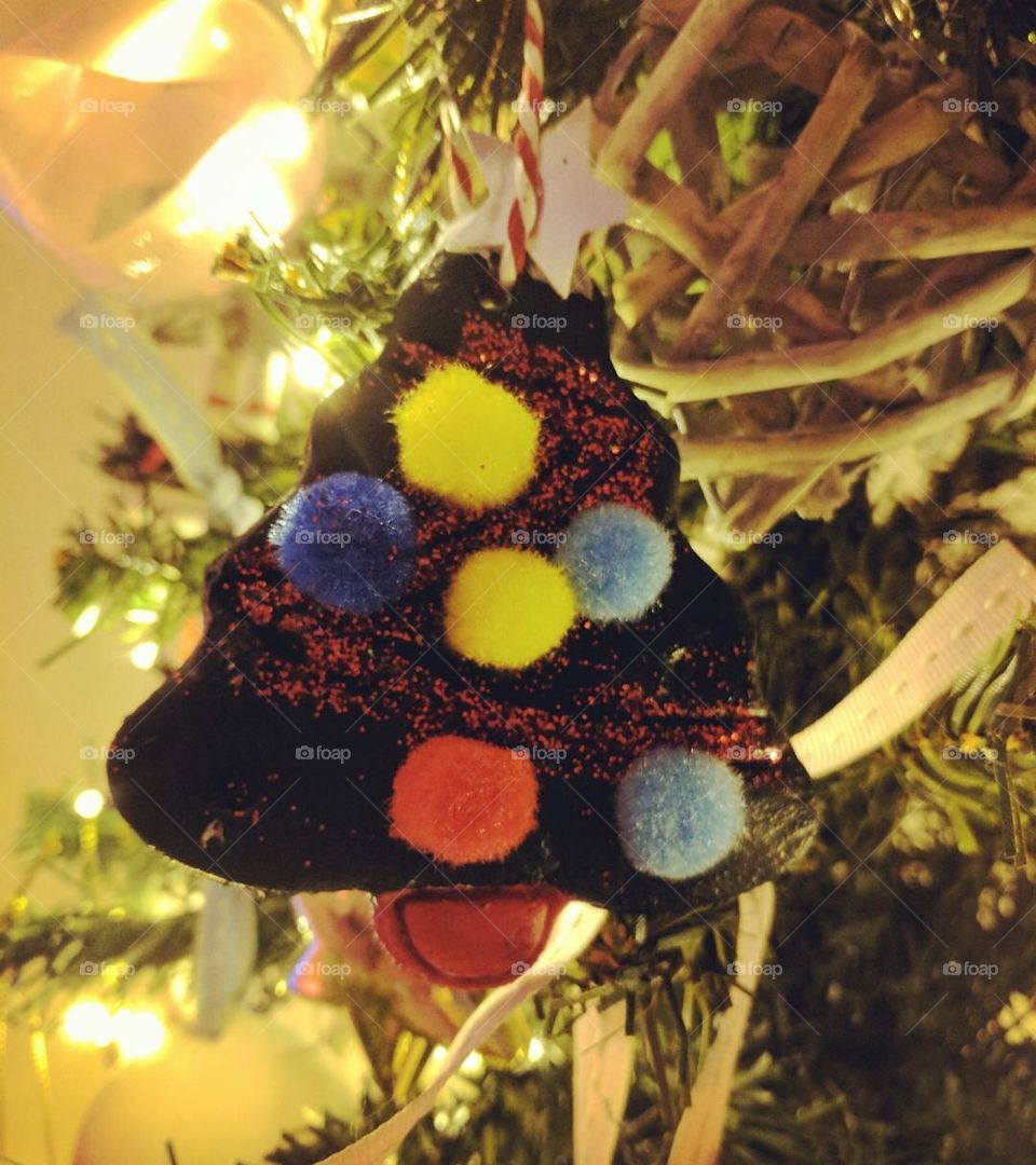 Baby's first Christmas decoration close up on a tree