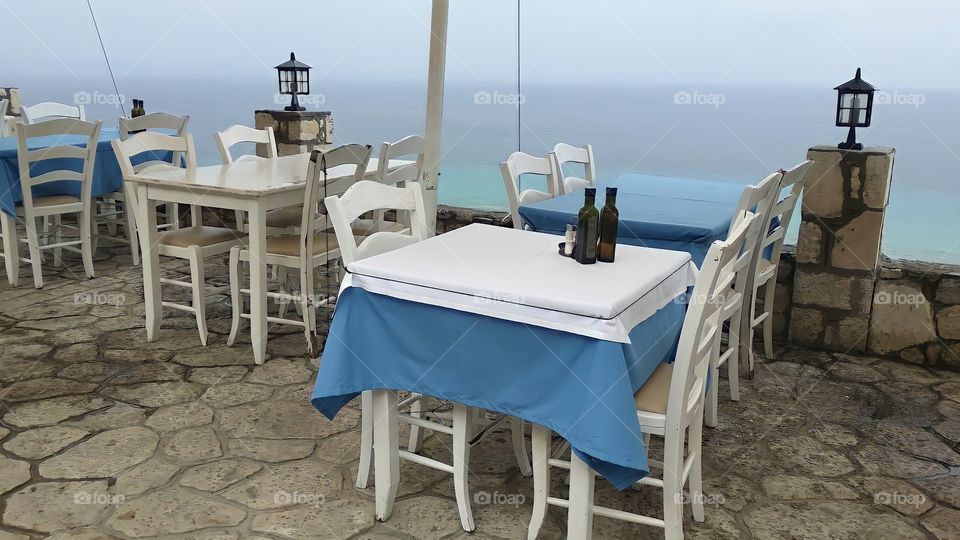 photography of a heavenly restaurant on the Mediterranean coast (Greece)