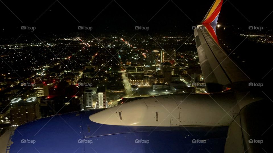 Southwest Airlines Boeing 737 flying over Downtown San Jose at night about to land at Norman Y. Mineta San Jose International Airport (SJC)