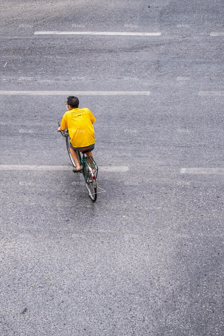 A man ride bycycle on road
