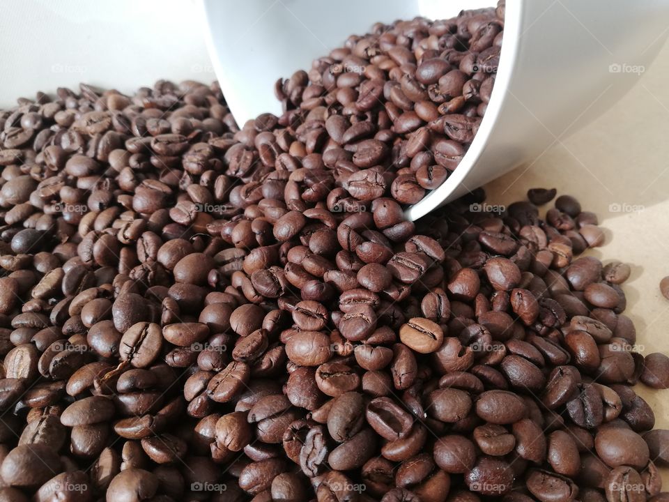 Coffee beans scattered on the table