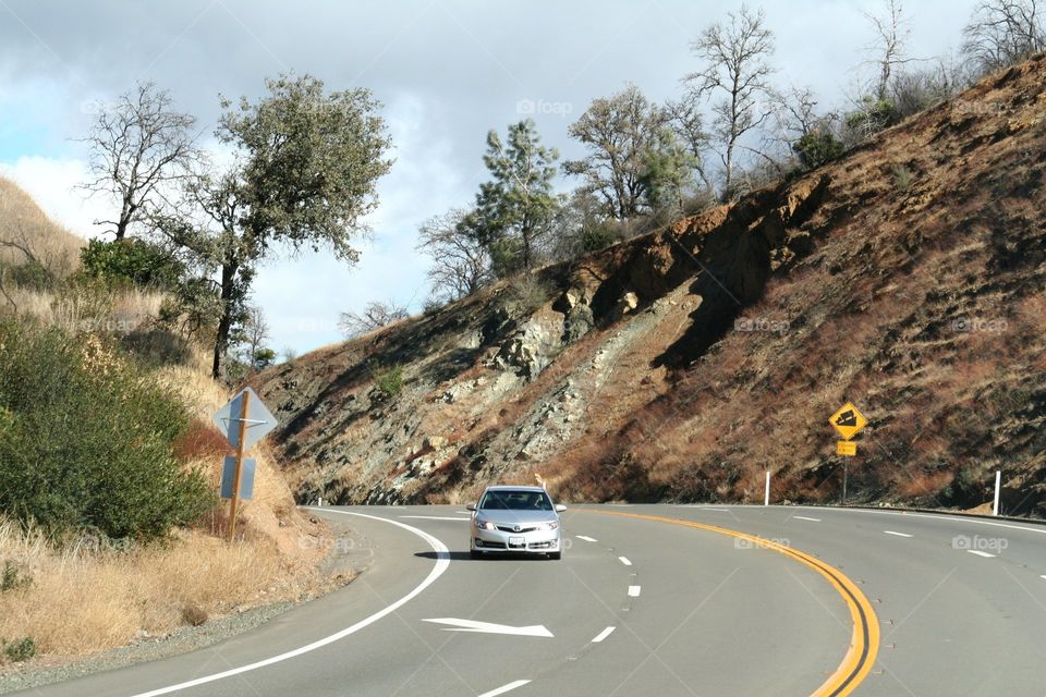 Open Road. A car out on the open road in the mountains of California.