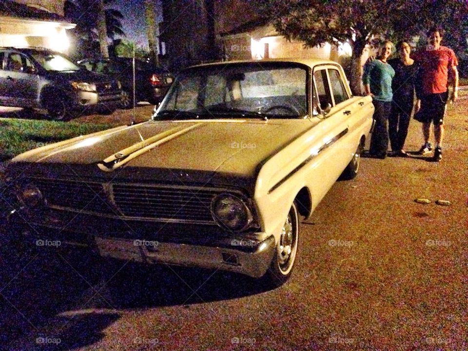 1956 Ford Falcon parked in the street at night