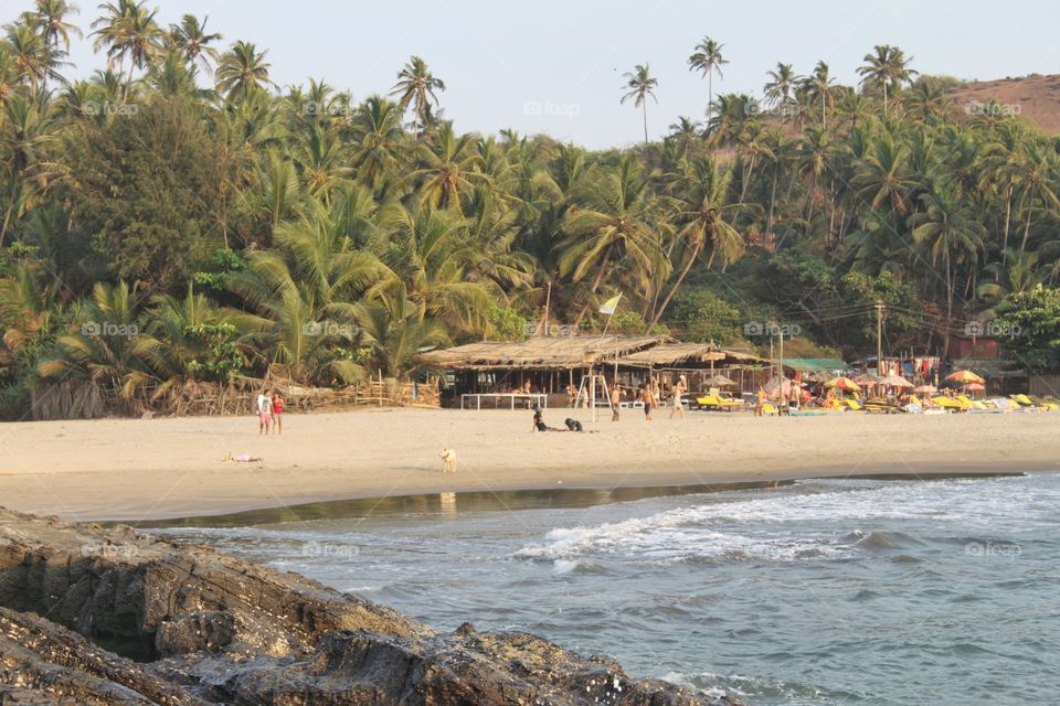 Goa summer beach breeze fun vacation with worldwide visitors well maintained famous hundred's of tourists daily n a must see place