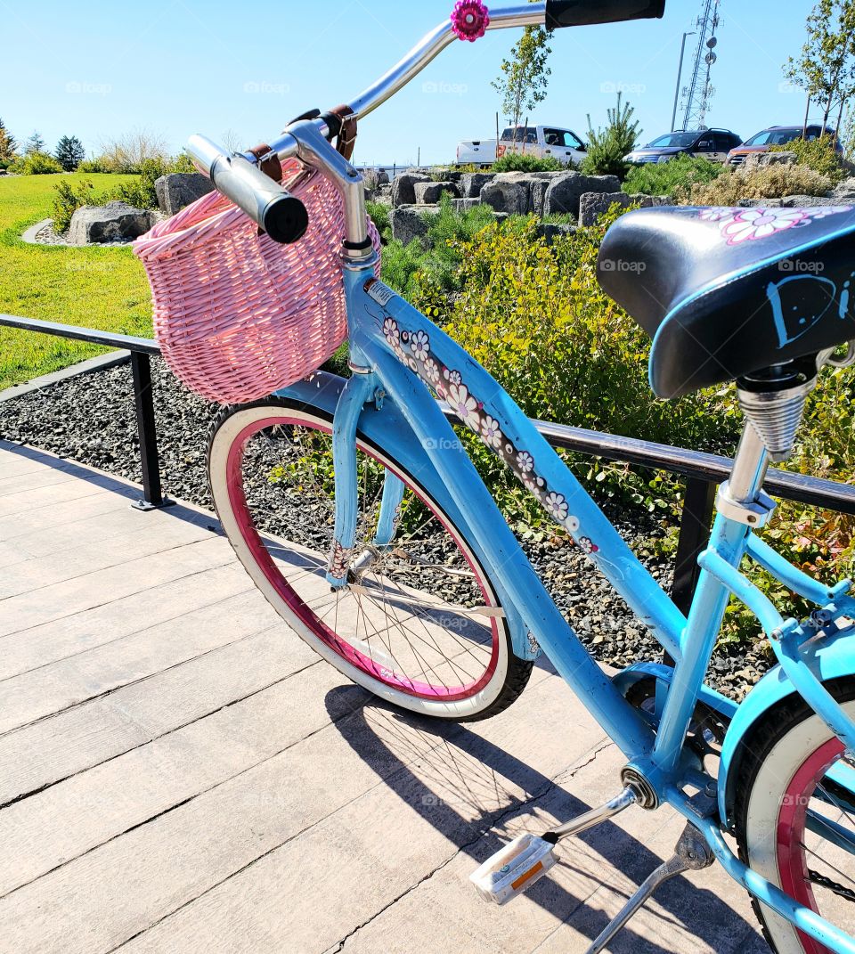 Sometimes the best way to get around is on a bike.  This particular bike is colorful and vintage style.