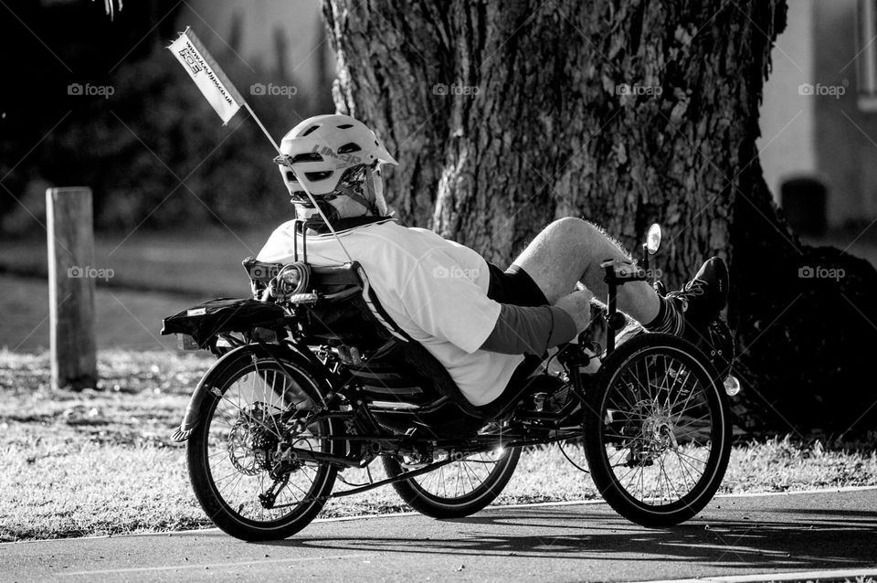 Recumbent bicycle rider on the move.