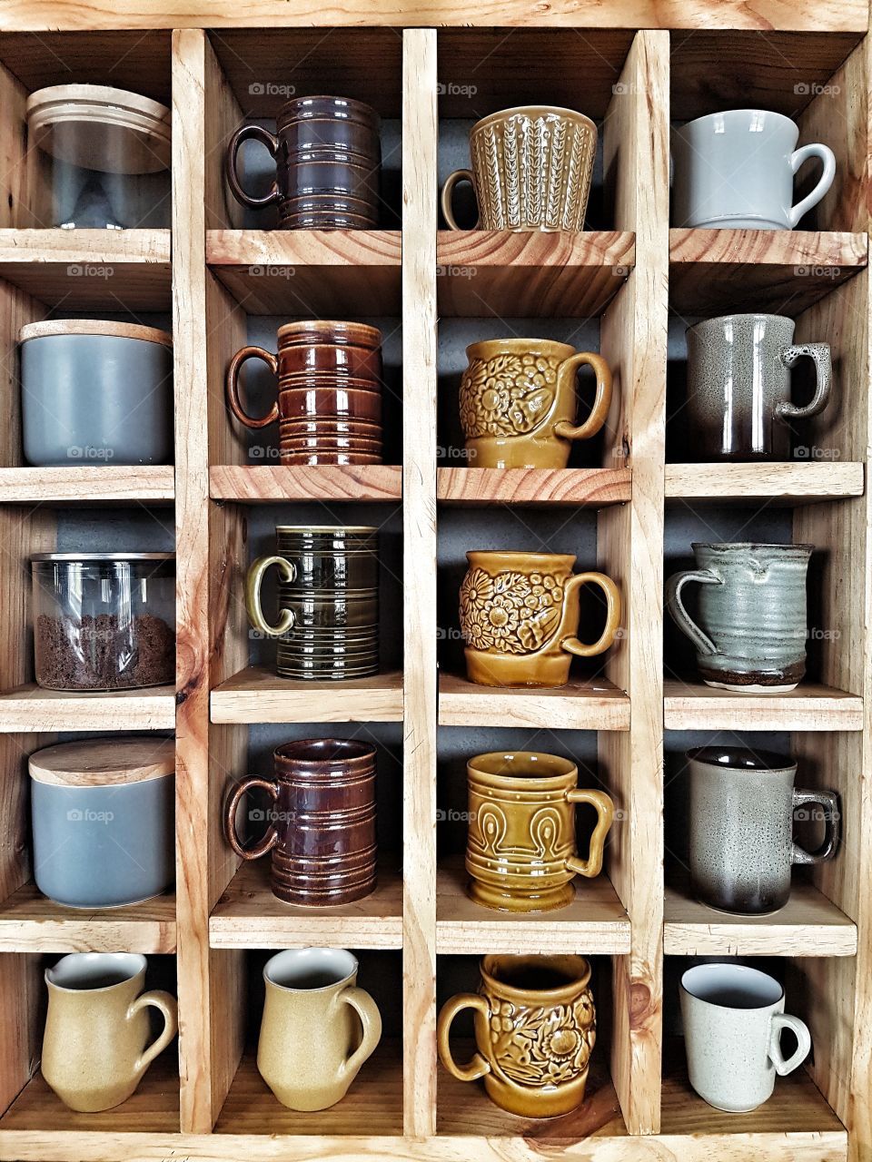 Wooden Cube shelf with vintage coffee mugs and pottery