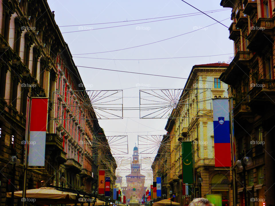 Street in Milan with the flags that remember Expo 2015