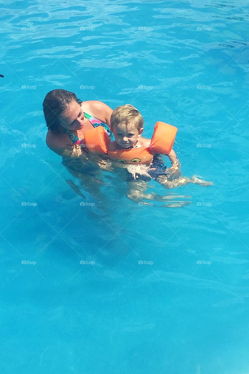Me helping my little boy learn how to swim. 
