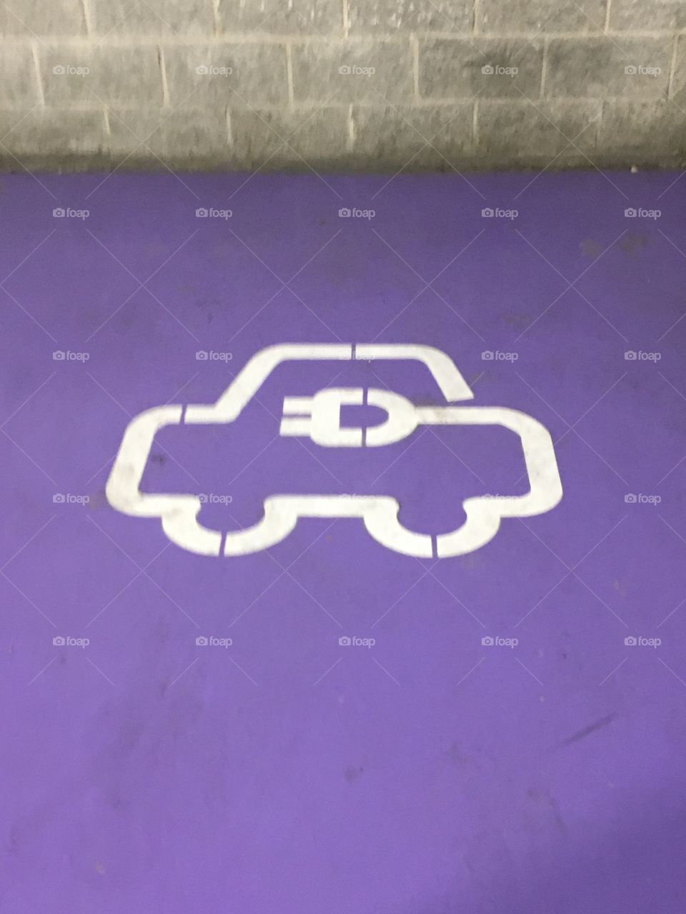 Electric car symbol on purple box ground